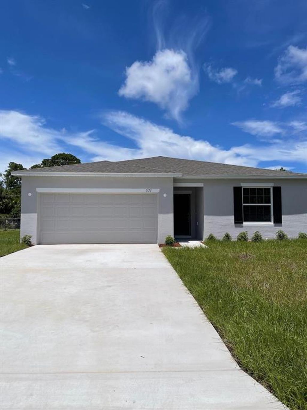 Photo of 371 NE Genesee Avenue, Port Saint Lucie, FL 34983 (MLS # R10753082)