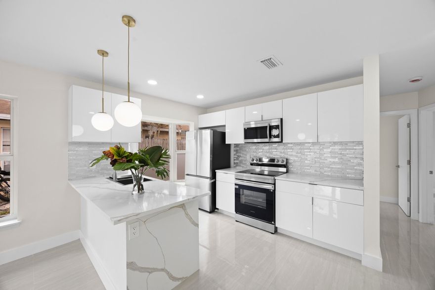 Fully renovated 2BR/2BA single-family home in Boynton featuring a 1-car garage and modern upgrades throughout. Enjoy peace of mind with a 2026 roof, 2026 impact windows, and 2026 appliances. The home has been freshly painted and beautifully updated, offering a bright and move-in-ready interior. The fenced backyard provides great space for pets, entertaining, or relaxing outdoors. Investor friendly--can be rented immediately. Located in a well-kept community with a pool and very low HOA under $100/month. Conveniently situated near the Florida Turnpike, shopping, dining, and local amenities. A great opportunity for homeowners or investors alike!