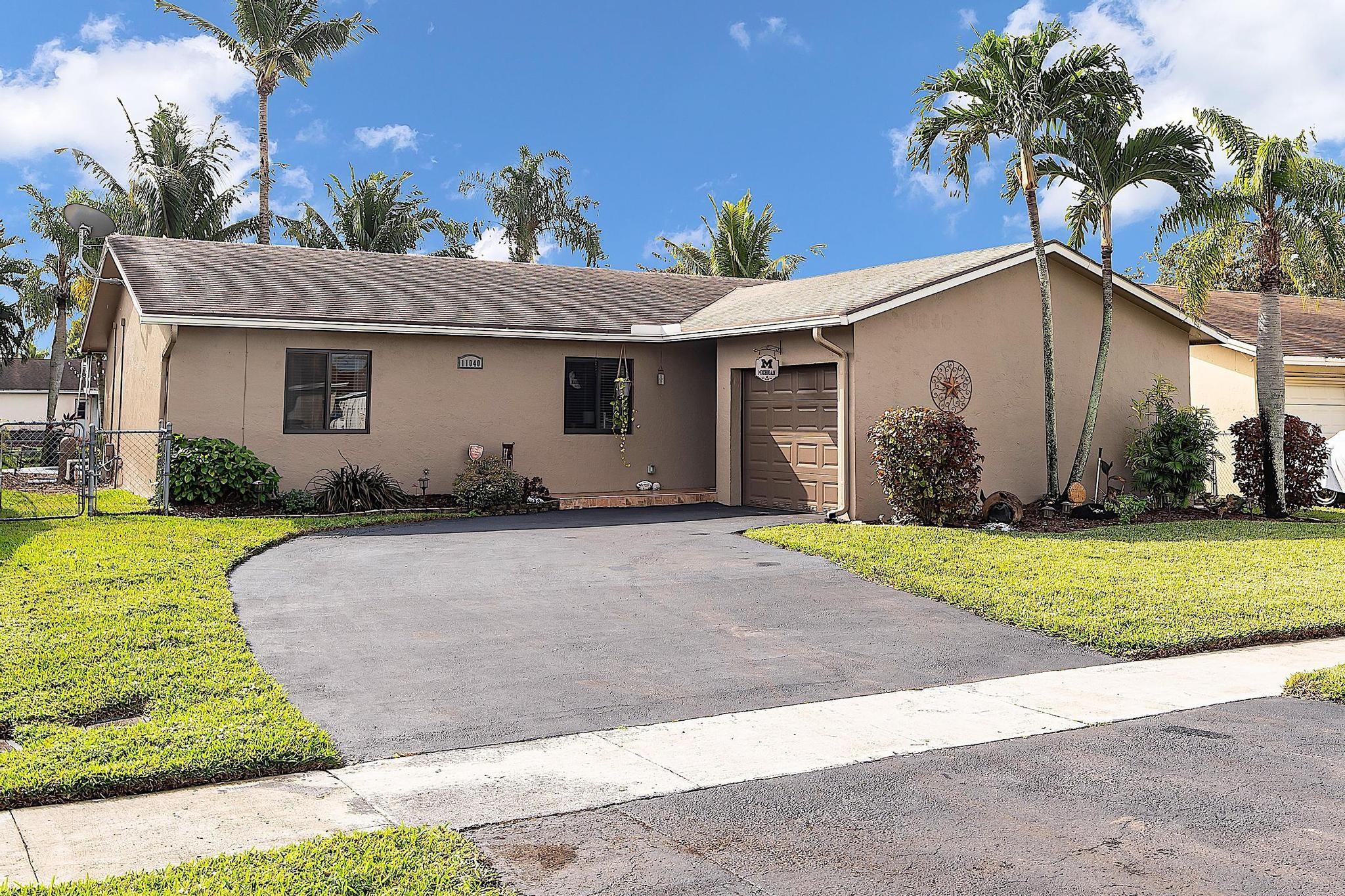 This immaculate property features impact windows & doors and a modern kitchen equipped with exquisite wood cabinets, granite counters, and a spacious island—all complemented by stainless steel appliances. The beautifully updated bathrooms showcase tile, wood cabinets, granite counters, and upgraded plumbing and ceramic tile throughout. The finishing touch is stepping outside to a private, landscaped pool area adorned with a serene canal view. The pool is complete with a new motor pump and freshly refinished flooring, making it perfect for relaxation or entertaining. Brand New A/C & duct system! New flat roof to be installed. This home is not just beautiful, it’s ready for you. Don’t miss this fantastic opportunity!