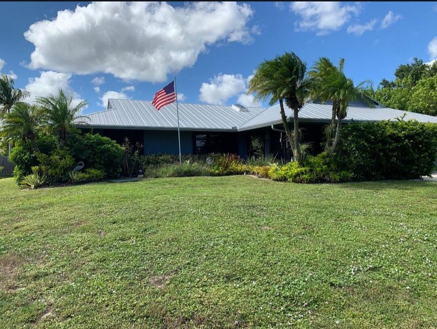 COMING SOON   Welcome to your own private Florida paradise! This beautifully maintained coastal-inspired ranch offers the perfect blend of tropical outdoor living and warm interior charm. Featuring a durable metal roof, lush landscaping, soaring ceilings, wood-look flooring, and a stunning stacked-stone accent wall, this home was designed for comfort and entertaining. The spacious kitchen includes granite countertops, stainless steel appliances, custom cabinetry, and a large center island overlooking the expansive screened lanai. Enjoy multiple outdoor seating areas surrounded by tropical palms, creating the ultimate indoor-outdoor Florida lifestyle. More details coming soon!