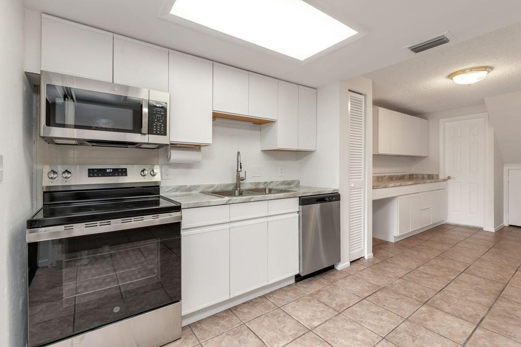 Photo of 4330 Lilac Street #F, Palm Beach Gardens, FL 33410 (MLS # R11105039)