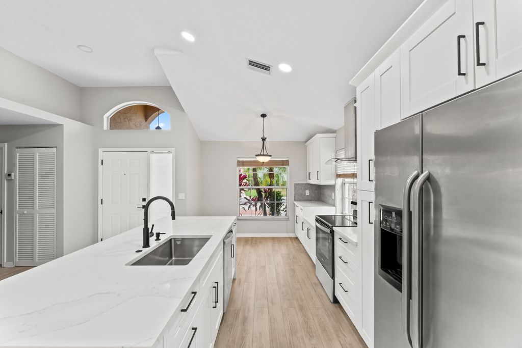 Photo of 2022 Bonisle Circle, Riviera Beach, FL 33418 (MLS # R11133262)