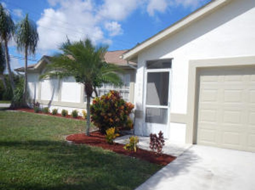 Refreshed Home on corner lot. Lots of tile, newer AC, newer water heater, fresh paint inside & out. Newer bathroom vanities. Spacious screen porch. Buyer assumes water & sewer assessment & connection fees. Close to St Lucie West & Tradition, don't miss this move in ready home.