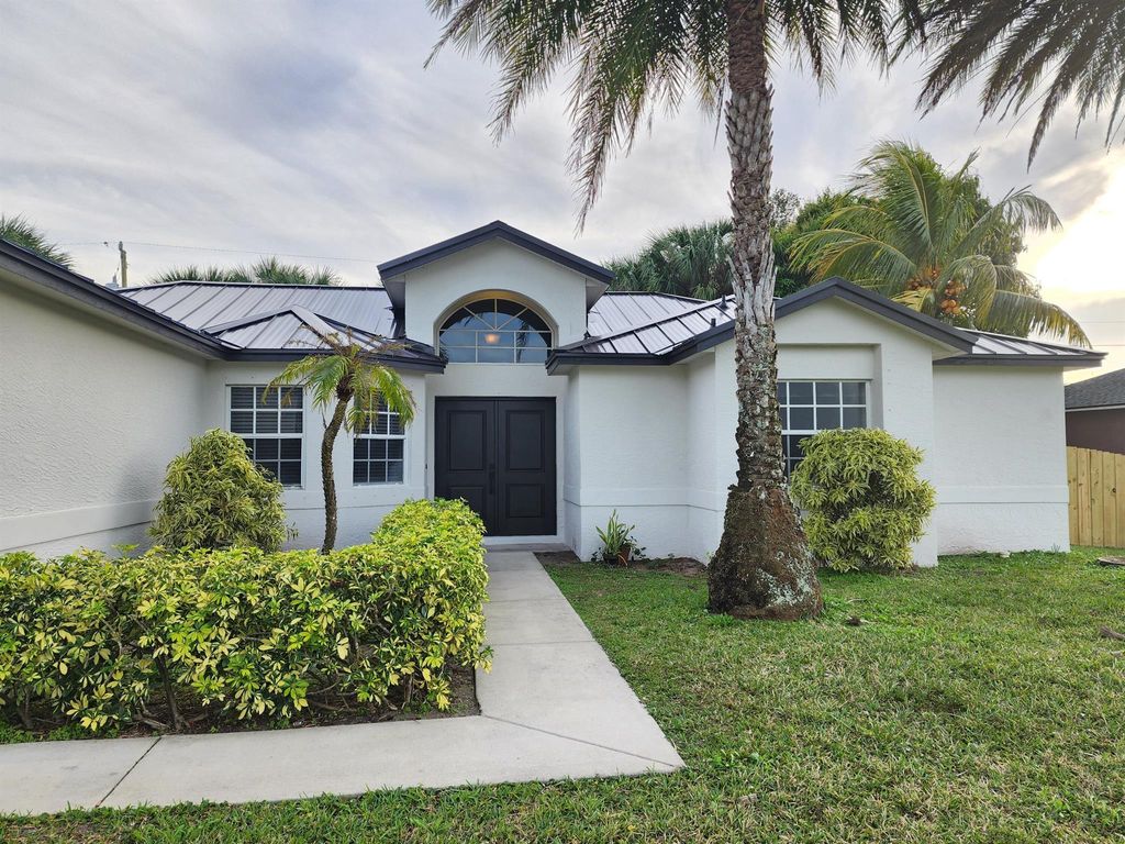 Photo of 1516 SW Escobar Lane, Port Saint Lucie, FL 34953 (MLS # R11048487)