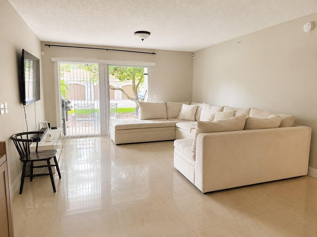 Photo of 5045 Wiles Road #105, Coconut Creek, FL 33073 (MLS # B26046011)