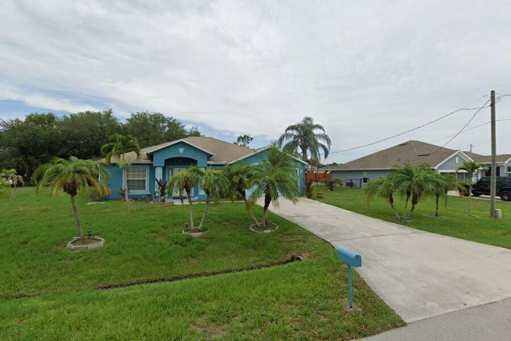 Photo of 5303 NW Nassau Lane, Port Saint Lucie, FL 34983 (MLS # R11112008)