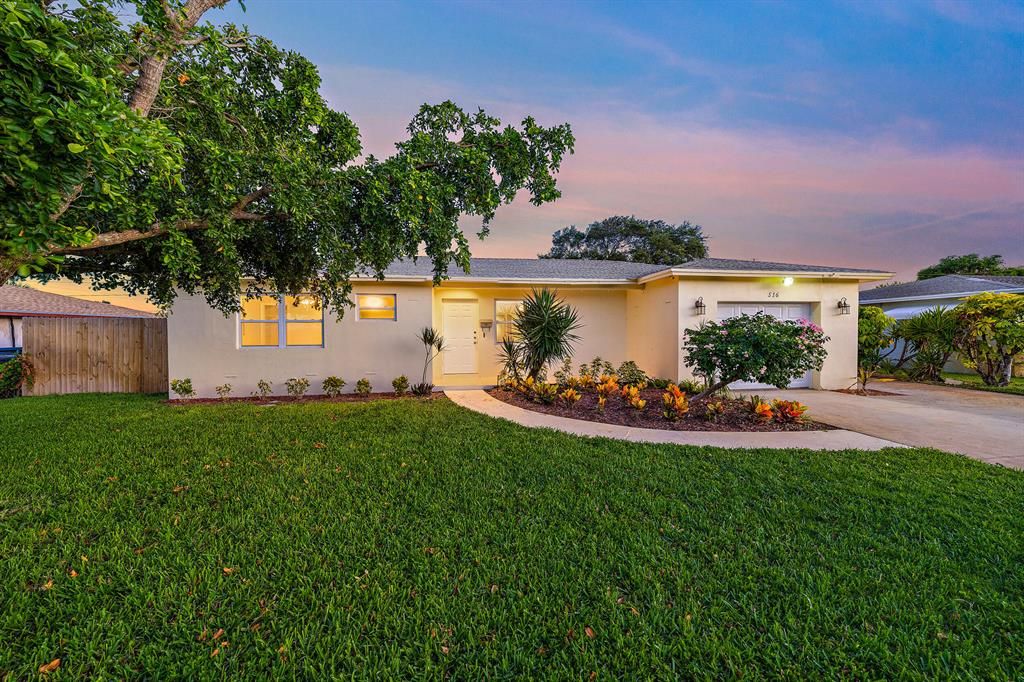 Photo of 516 Cypress Drive, Lake Park, FL 33403 (MLS # R10821284)