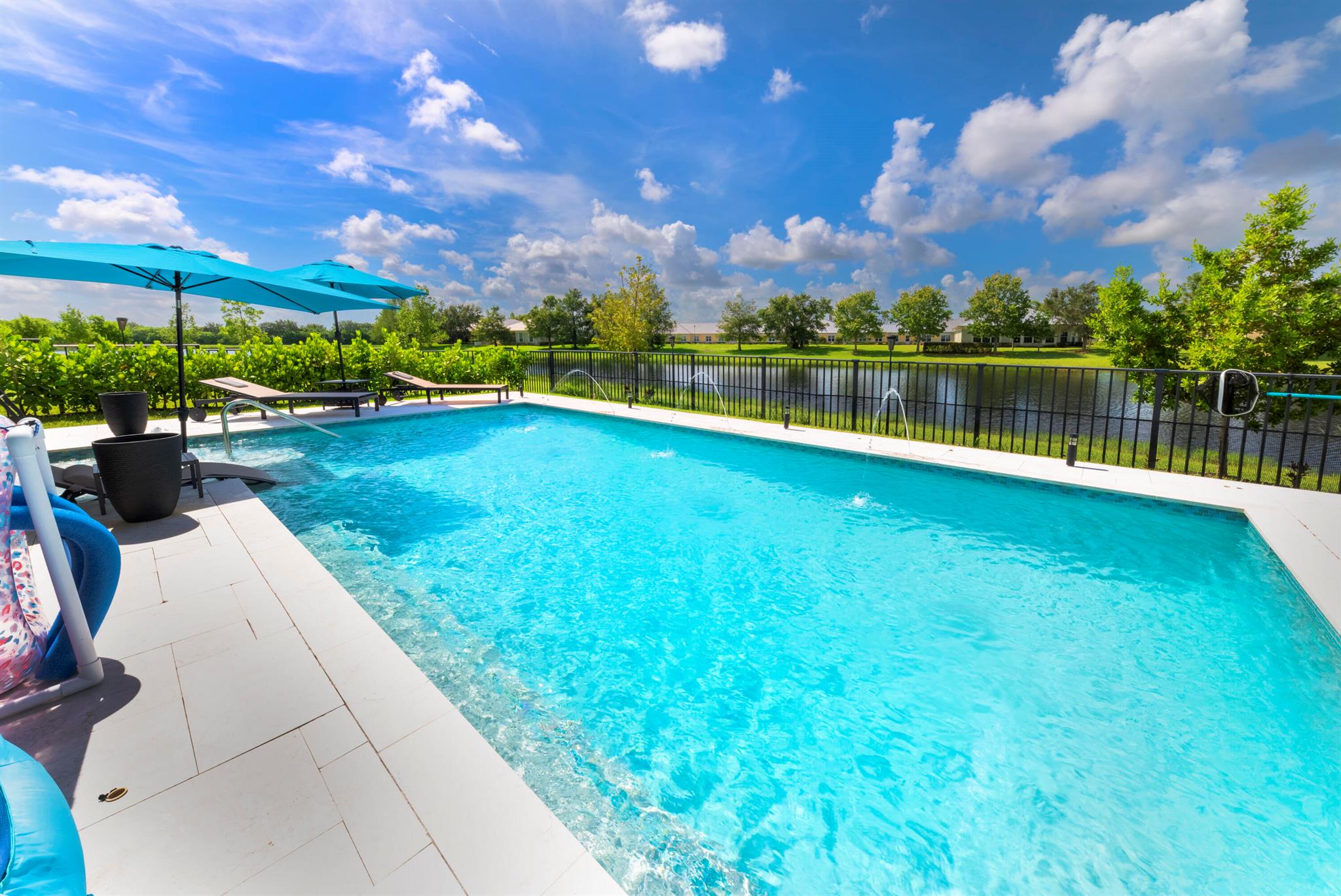 STUNNINGLY BEAUTIFUL NEWLY BUILT 2023 LAKEFRONT HOME WITH NEW SALTWATER POOL & SPA. FULLY FENCED WITH LUSH LANSCAPING AND PAVER WALKWAYS AROUND THE HOME. MODERN LUXURY & COMFORT EXUDE IN THIS 3 BEDROOM + FLEX ROOM ( 4TH BEDROOM) IS OPEN & BRIGHT WITH LOTS OF WINDOWS AND DOORS. ALL IMPACT GLASS! ENCHANTING BACKYARD WITH BEAUITFUL VIEWS OF THE LAKE. GAS HEATED POOL & SPA WITH SUN SHELF FOR ENJOYING FLORIDA'S WEATHER YEAR ROUND. UPGRADED MASTER SUITE AND SECOND BATH FROM BUILDER. HIGH END CEILING FANS & LIGHTING ON DIM SWITCHES. CUSTOMM LAUNDRY WITH NEW WASHER/DRYER & SINK. EPOXY GARAGE FLOOR. HOA INCLUDES GATE,CABLE, HI-SPEED INTERNET,ALARM,LAWN CARE COMMUNITY POOL ,EUFY SECURITY CAMERAS STAY WITH HOME.