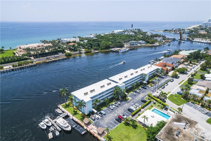 Terrific Location with AMAZING direct intracoastal views. This updated 2 bedroom & 2 bathroom unit has one of the best views in the complex. This building is located in the desirable marina district of Lighthouse Point. This elegant unit boasts brand new floors in kitchen, living and dining area, inlaid wood ceiling, spacious living/dining area with custom lighting, beautiful custom kitchen with granite countertops, stainless steel appliances, wine cooler, wet bar and breakfast bar. Impact rated windows and walk in closet in primary bedroom. You can own your slice of paradise in this all ages community with heated pool, clubhouse & tiki hut right on the water. Brand new roof. Complex has private dock with possible boat slips to rent or buy. Land lease is included in maintenance dues.