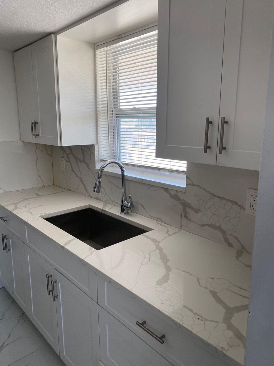 Totally remodeled! This gorgeous 1 bedroom is located in convenient East location! Less than half mile to US-1 and short distance to beaches!  Beautiful tile throughout the spacious unit. Brand new kitchen boasts new shaker cabinets, new granite countertop, new appliances! New bathroom! Storage closet! Elevator in building as well as laundry facilities.
