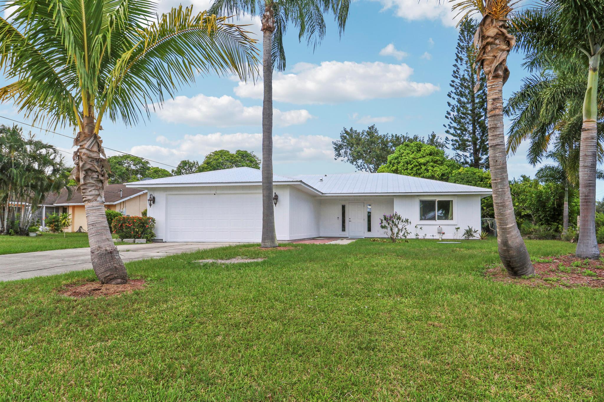 Welcome to this beautifully maintained 3-bedroom, 2-bath home situated on a spacious 1/3-acre oversized corner lot in a prime, family-friendly location. Featuring impact windows and a durable metal roof, this home offers peace of mind and energy efficiency year-round.Enjoy an open and functional layout perfect for comfortable living and entertaining. The large backyard provides ample space for outdoor fun and has plenty of room to add your dream pool. Whether you're hosting gatherings or enjoying a quiet evening, this outdoor space is ready to be transformed into your private oasis.Located within walking distance to Mariposa Elementary School, and just minutes from shopping centers, restaurants, and top-rated hospitals, this home offers the perfect blend of convenience and community.