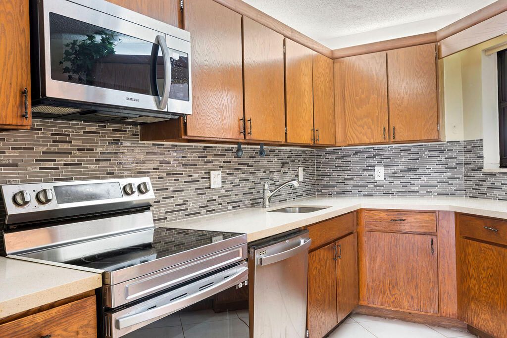 Photo of 5701 Camino Del Sol #204, Boca Raton, FL 33433 (MLS # R11160619)