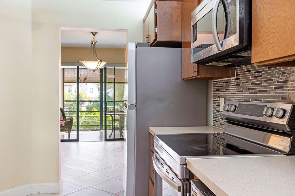 Photo of 5701 Camino Del Sol #204, Boca Raton, FL 33433 (MLS # R11160619)