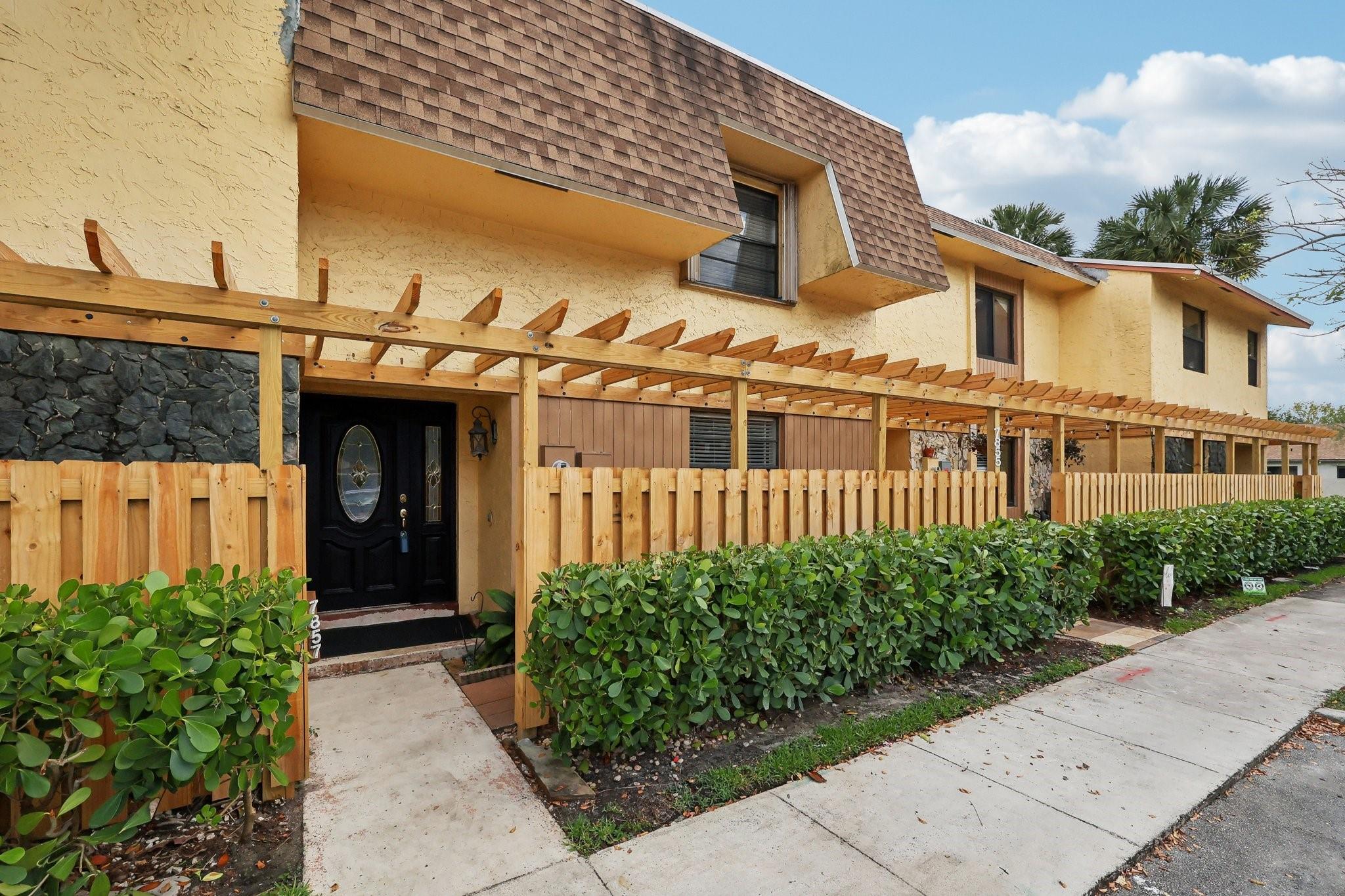 Great location! Don't miss this spacious 1,912 sq. ft. 3 bedroom, 2.5 bath townhome in Villas of Plantation. Roof replaced in 2023 with new separation wall & built-up insulation for positive water run-off. New fence front & back 2025. On demand water heater. Accordion hurricane shutters on 2nd level. Two dedicated parking spaces; one at front of house. Large deck for outdoor entertaining, retractable awning, and direct access to Marcano Estates Park through your backyard gate! Neutral décor. Tile floors throughout. Kitchen features Granite counter-tops, stainless steel appliances, updated cabinetry. Updated baths. Amenities include Pool and Tennis Court. Convenient to major throughways, shopping, entertainment venues, restaurants, schools, etc.