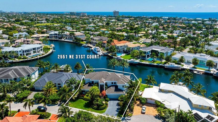 There is not a better view in the City of Lighthouse Point!  Built in 1999 and ahead of it's time this masterpiece is all CBS construction on the exterior with concrete between the 2 floors as well as the stairwell.  Enter this amazing home and experience glass everywhere. The structure was situated on the lot to allow you to take in the views that look over a bay and some of the most expensive properties in the City. The backyard is a tropical oasis with covered patios, a pool with integrated spa, and a covered summer kitchen. Whole house generator. The 112 foot dock was built straight, taking our the curve in the seawall so that it will accommodate up to a 112 foot vessel and features batter piles as well as concrete pilings. This is a rare opportunity and ready for you to make your own!