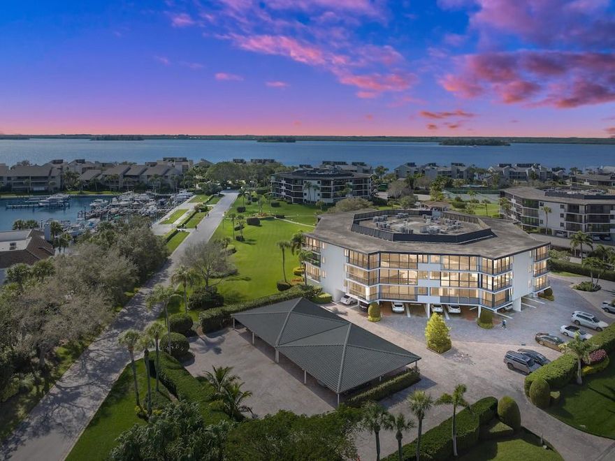 Breathtaking River and Marina Views from this Stunning Condominium located in Harbourside East at The Moorings. This property allows for the opportunity to transfer a Club Membership to the highly desirable Moorings Yacht and Country Club bypassing the waitlist. This turnkey, fully furnished property boasts two full en-suites and an open floor plan. The current owner has completely renovated the bathrooms, kitchen and replaced all of the flooring in the main living areas. Enjoy views from your large, covered balcony with large sliders that that open to the outdoors. A designated under building, covered parking spot allows for easy access to the unit. The community offers beautiful walkways, pool, tennis and community rooms, perfect for hosting as well as private beach access.