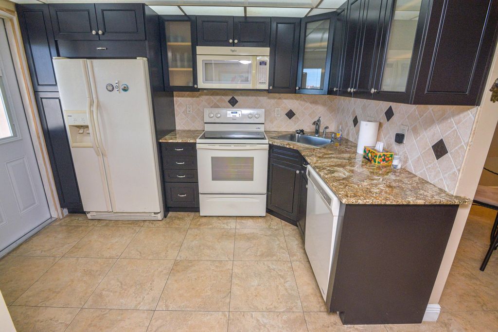 Photo of 2661 S Course Drive #707, Pompano Beach, FL 33069 (MLS # B26003591)