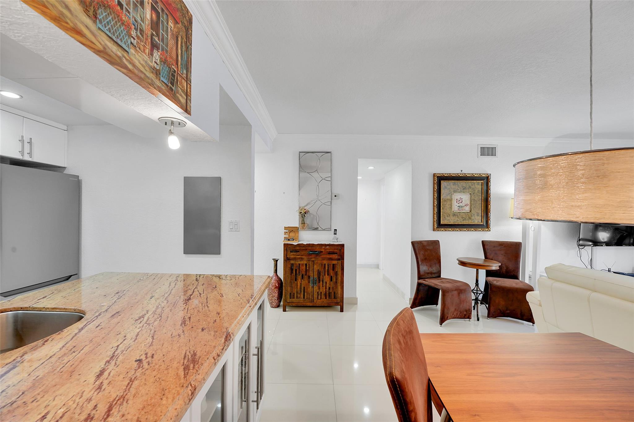 Come see our beauitful home in North Miami Beach. Only a short drive to the ocean and world renowned attractions! This place is turn key ready for you to move in and enjoy. Ground floor 2-bedroom, 2-bathroom unit featuring extensive updates and a highly desirable layout. Renovated with tile flooring throughout, a modern kitchen with granite countertops and stainless steel appliances, and updated bathrooms with quality finishes. Enjoy the privacy of a screened-in patio and convenient access to community amenities.
Located in a gated community offering a pool, fitness center, and beautifully maintained green spaces.
Furniture may be included or negotiated separately.
Conveniently situated near shopping, dining, and local attractions.