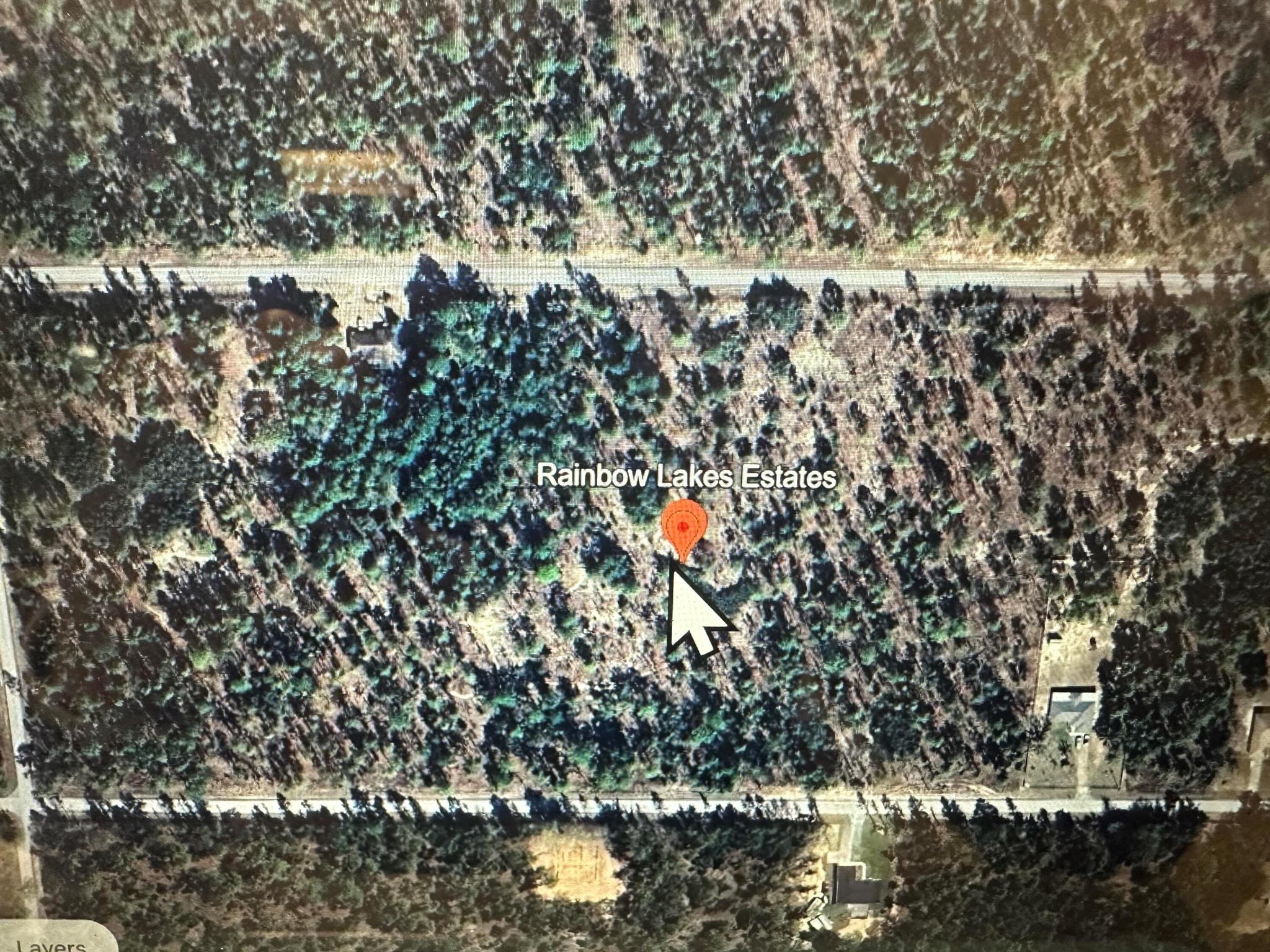 Amazing area with .99 acre lot in Rainbow Lakes . This is a growing area and is close to World Equestrian Center. Homes built in area.