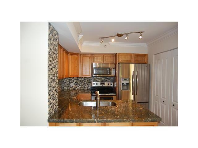 Welcome to Yacht Club on the intracoastal. Fantastic upgraded townhouse with garden views and close to all of the amenities. Tile throughout with no carpet, brand new refrigerator, newer washer and dryer, accordion hurricane shutters and will be freshly painted. Rent includes water, cable and HBO. Do not miss out on luxury living for a fraction of the price. Yacht Club on the Intracoastal is a 26-acre gated community featuring a 46 slip resident marina, sand volleyball court, tennis and pickleball courts, dog park, clubhouse, movie theatre, fitness trail, business center,2-swimming pools, hot tub, fishing area, bicycle storage, bbq areas & much much more! This is the place to be!