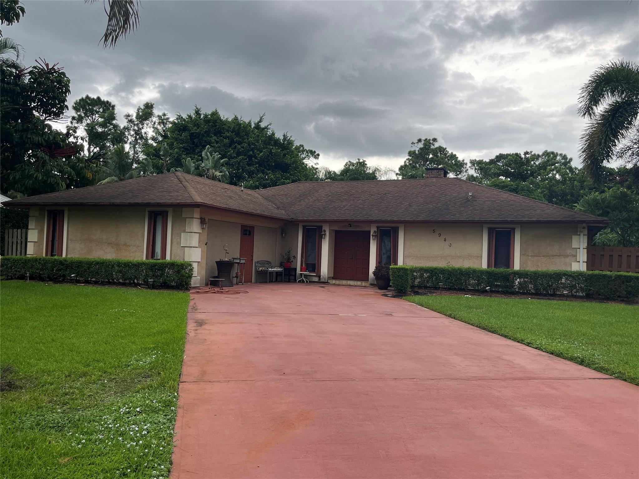 This spacious home sits on an expansive lot in one of Greenacres’ most desirable neighborhoods, offering both comfort and charm. Surrounded by lush landscaping, the property boasts a serene garden view that can be enjoyed from multiple rooms and the outdoor living spaces. Inside, you’ll find an open and airy floor plan with generously sized rooms. The large lot provides ample space for outdoor entertaining, gardening, or simply relaxing in privacy.