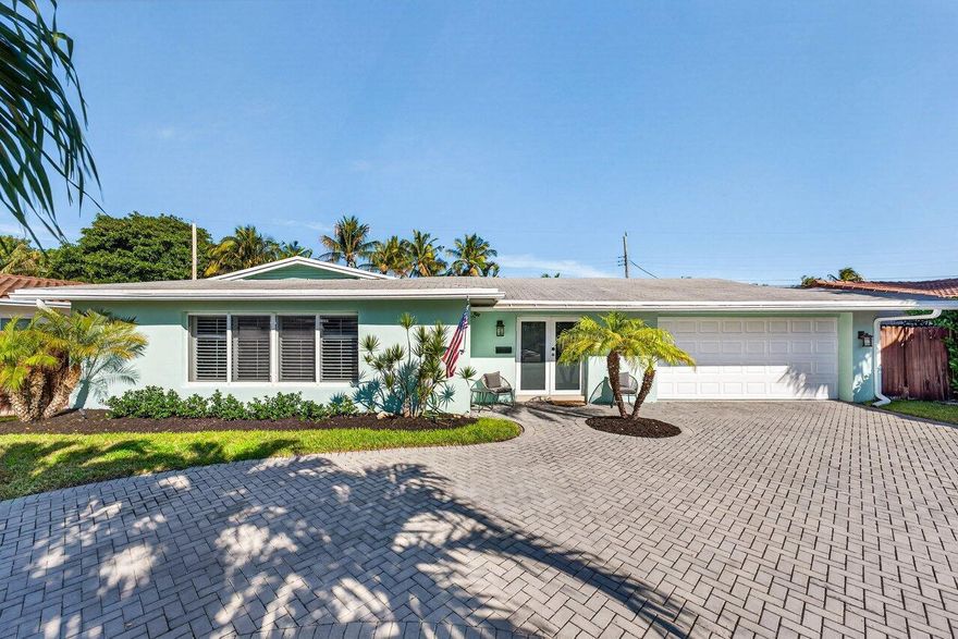 Welcome to this charming home in THE COVE! Walk or bike to the beach from this renovated single-family home, nestled in one of Deerfield Beach's most desirable neighborhoods. This coastal-style residence features extra living space, 3 bedrooms, 2 full bathrooms, attached garage, circular driveway, and an expansive lot with plenty of yard space. Enjoy the perfect blend of comfort and style with an outdoor oasis that includes a custom heated pool and TV, perfect for entertaining and soaking up the sun. Ideally situated East of Federal Highway, this home offers convenient access to beaches, dining, shopping, and entertainment.  Impact glass complete.  Roof 2016.  HVAC 2026.  Water heater 2025.  All new pipes 2024.    Substantial upgrades; this house needs nothing!  Roof warranty.  Water heater warranty 10 years.