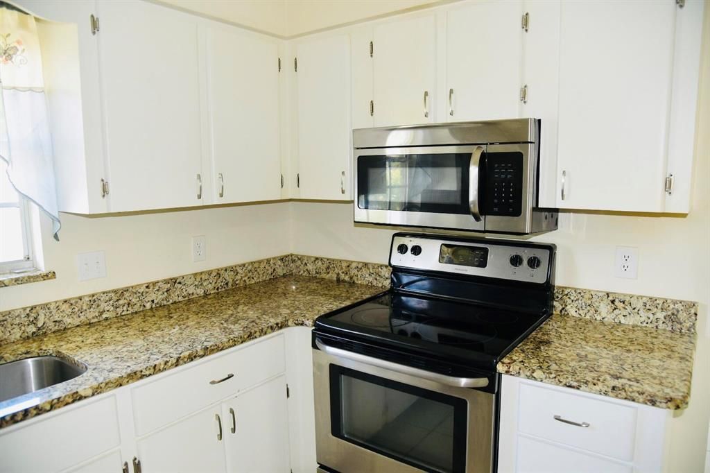 Photo of 681 NE Helicon Lane, Port Saint Lucie, FL 34983 (MLS # R10791436)