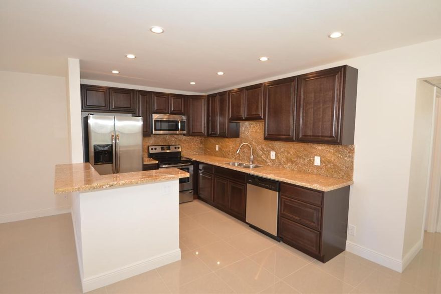 The most Luxurious immaculate Condo in Kings Point ever!! Breathtaking waterfront view from every angle. State of the art kitchen Granite counter top with Granite Back splash ,All new Marble floor throughout ,Brand new stainless steel appliances. Balcony room that includes Washer and dryer extension . Three multi-million dollar clubhouses with arts/crafts, library, indoor resistance pool, lap pool, outdoor pools all heated. Two golf courses (par three and executive). Tennis courts -Live entertainment weekly just two minutes walk away.