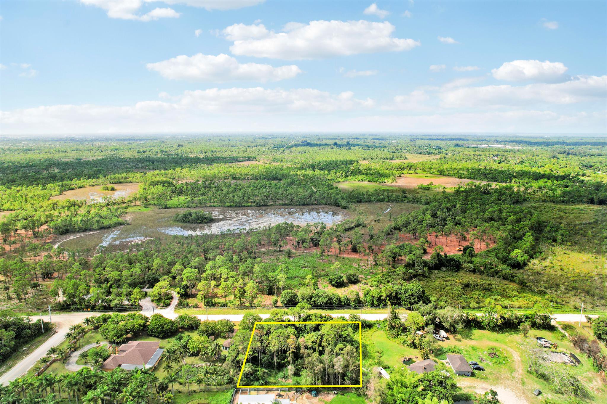 Discover your perfect slice of paradise on 40th Street North in Royal Palm Beach, FL! This 1.32-acre lot, nestled across from the serene Royal Palm Beach Pines--a haven often called a ''Wetland Wonderland''--is the ideal canvas for your dream home.Envision living amidst nature's splendor, as this 772-acre natural area offers diverse ecosystems like mesic flatwoods, wet prairies, and dome swamps. Immerse yourself in the vibrant wildlife, with frequent sightings of majestic bald eagles, red-shouldered hawks, and the graceful Florida sandhill cranes. Encounter other fascinating creatures such as bobcats, southern cricket frogs, and eastern box turtles.For nature enthusiasts, this location is a gem. Enjoy a brisk walk or a leisurely ride along the 2-mile equestrian trail or