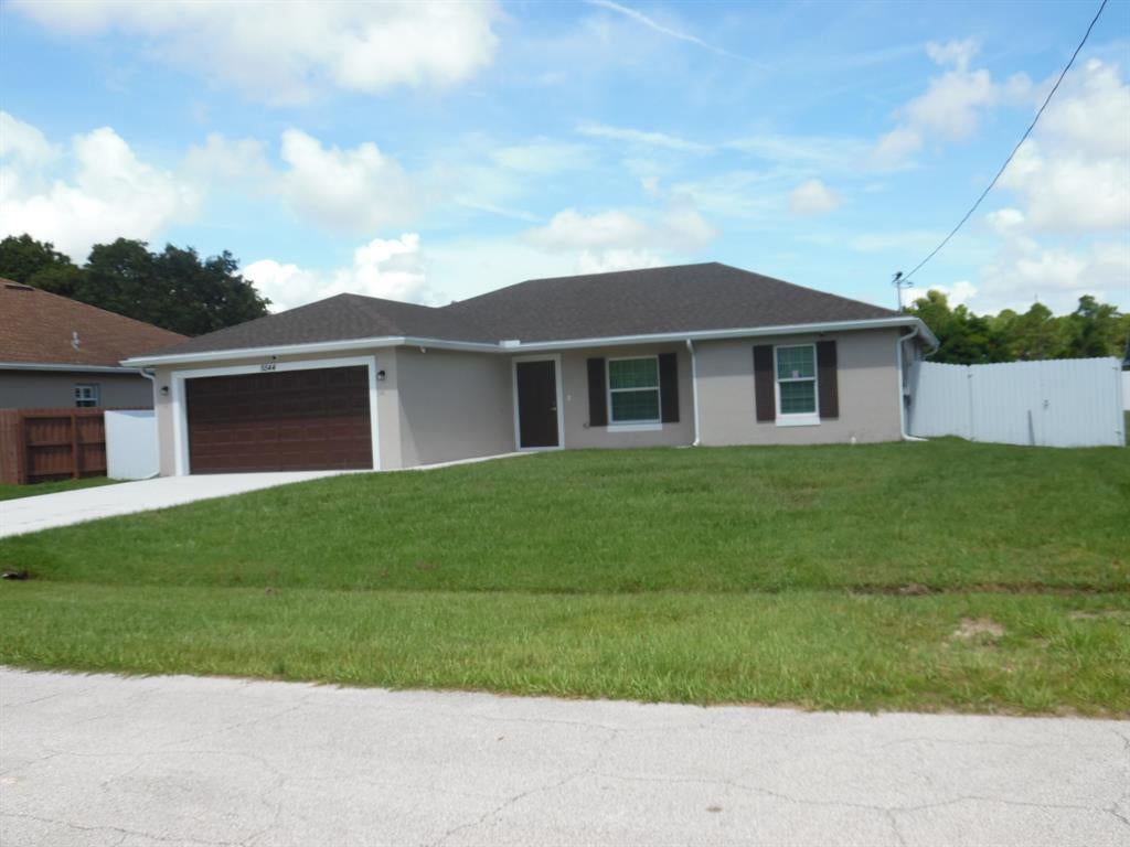 Photo of 5544 NW Burgin Street St, Port Saint Lucie, FL 34986 (MLS # R10826547)