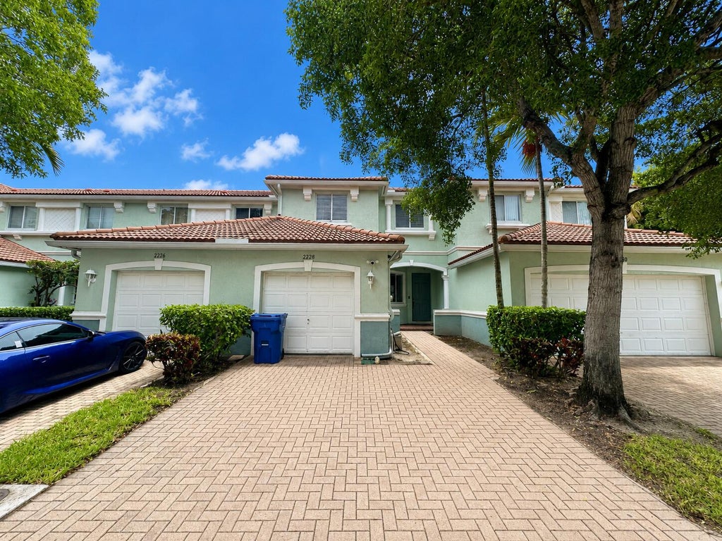 Photo of 2228 Oakmont Drive, Riviera Beach, FL 33404 (MLS # B26038113)