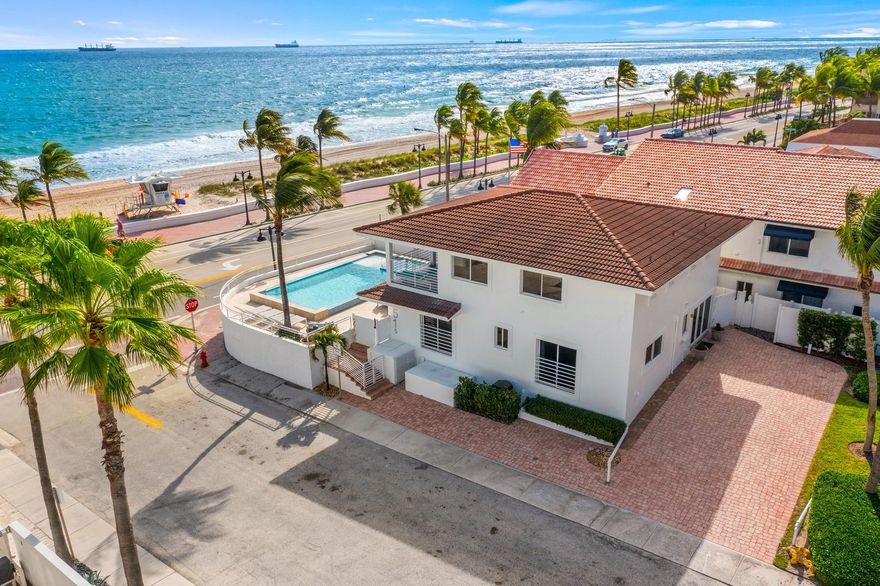The most affordable beach house in Fort Lauderdale! Enjoy expansive wide open ocean views from highly elevated corner residence (great views from many rooms)! Across from one of the best beaches & in the heart of Fort Lauderdale's beach life, nearby restaurants & shops. Stunning double-edged infinity salt water heated pool & jacuzzi, perfect for outdoor oceanside entertaining. Sold furnished (exclude art) ultimate floorplan flexibility, expansive chef's kitchen with dining island & large, bright living room. 1st level offers one bedroom suite & potential 4th bed/office, full bath. 2 upstairs bedrooms are studio apartments, ensuite baths, kitchenettes & large covered balcony, perfect to watch the sunrise! 6+ car parking, currently being used as a second home and AirBnB rental.