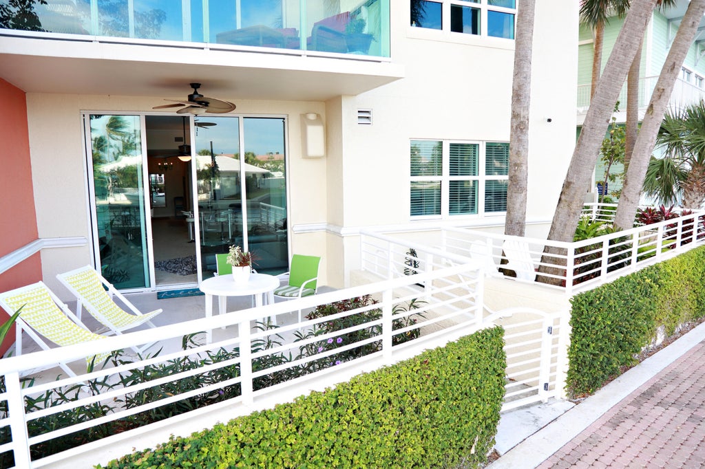 Photo of 2650 LAKE SHORE Drive #101, Riviera Beach, FL 33404 (MLS # B26080223)