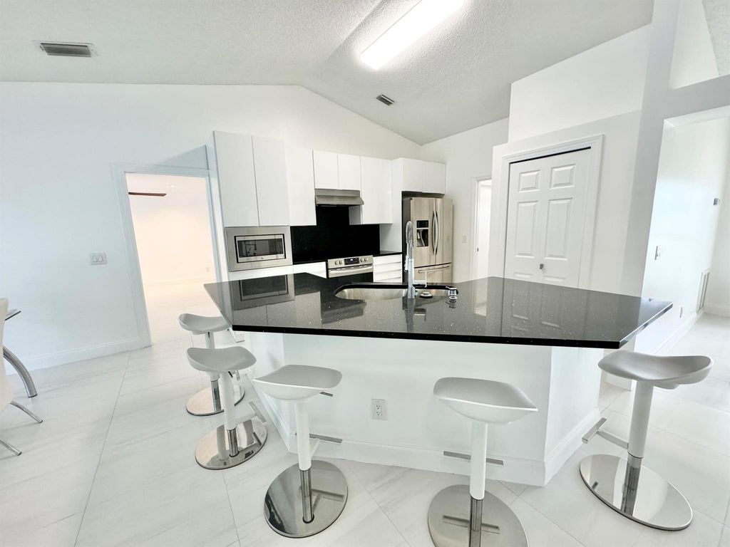 Photo of 602 SW Bradshaw Circle, Port Saint Lucie, FL 34953 (MLS # R11020505)