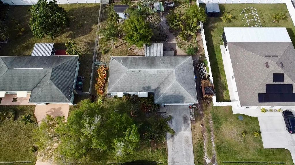 Photo of 933 SW Liberty Avenue, Port Saint Lucie, FL 34953 (MLS # R10963982)