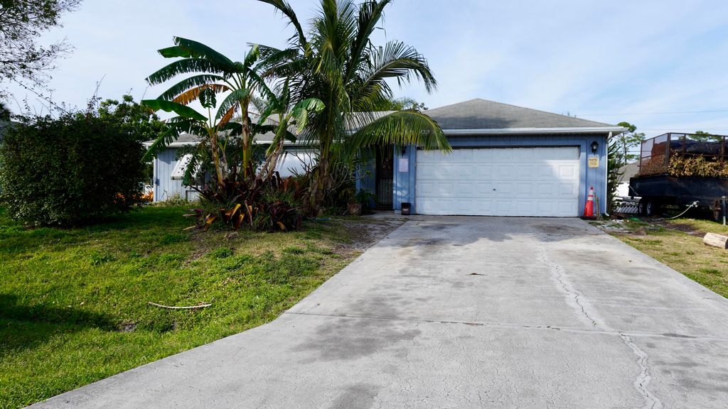 Photo of 933 SW Liberty Avenue, Port Saint Lucie, FL 34953 (MLS # R10963982)