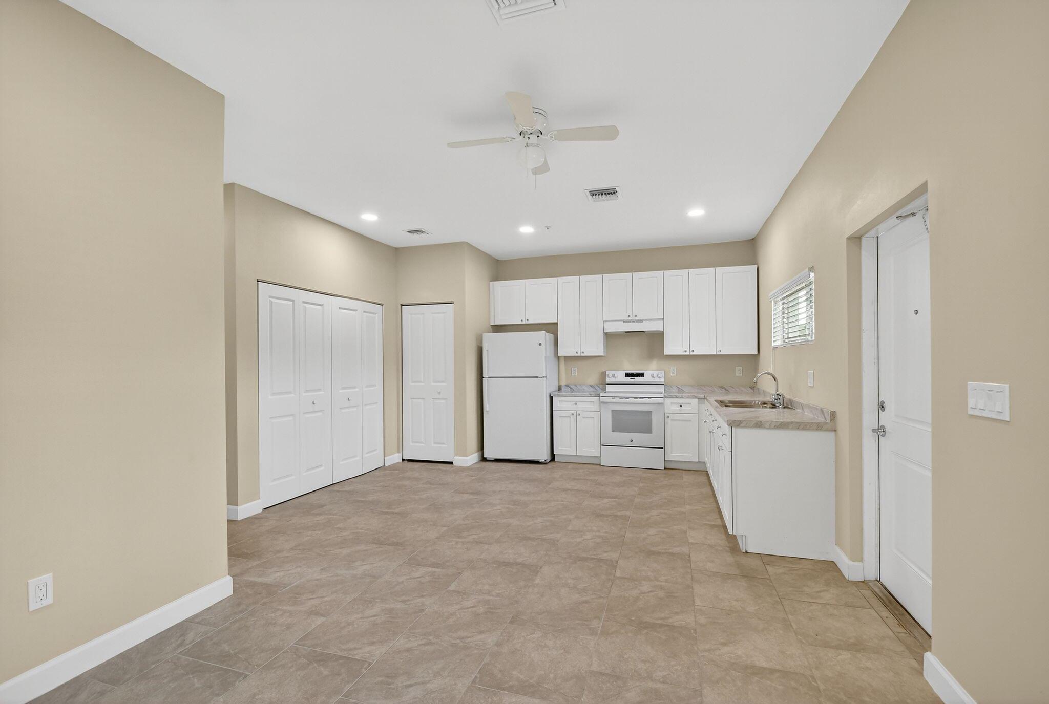 Experience modern living at its finest in these brand-new, two-story townhomes--perfectly located near Palm Beach State College, JFK Hospital, and I-95 for unbeatable convenience. Built in 2025, each home boasts sleek tile flooring downstairs, luxury vinyl plank on the second floor, and nearly 10' ceilings that elevate the bright, open layout. Enjoy stylish, never-before-used kitchens with brand-new appliances, plus an in-unit washer and dryer for ultimate comfort. *Move-in specials available now -- get your **first month free* and move in with only a *$2,500 security deposit!* Don't miss out on luxury living and an incredible deal--be among the first to call these townhomes home!  Impact glass windows, no hoa, easy and fast move-in.