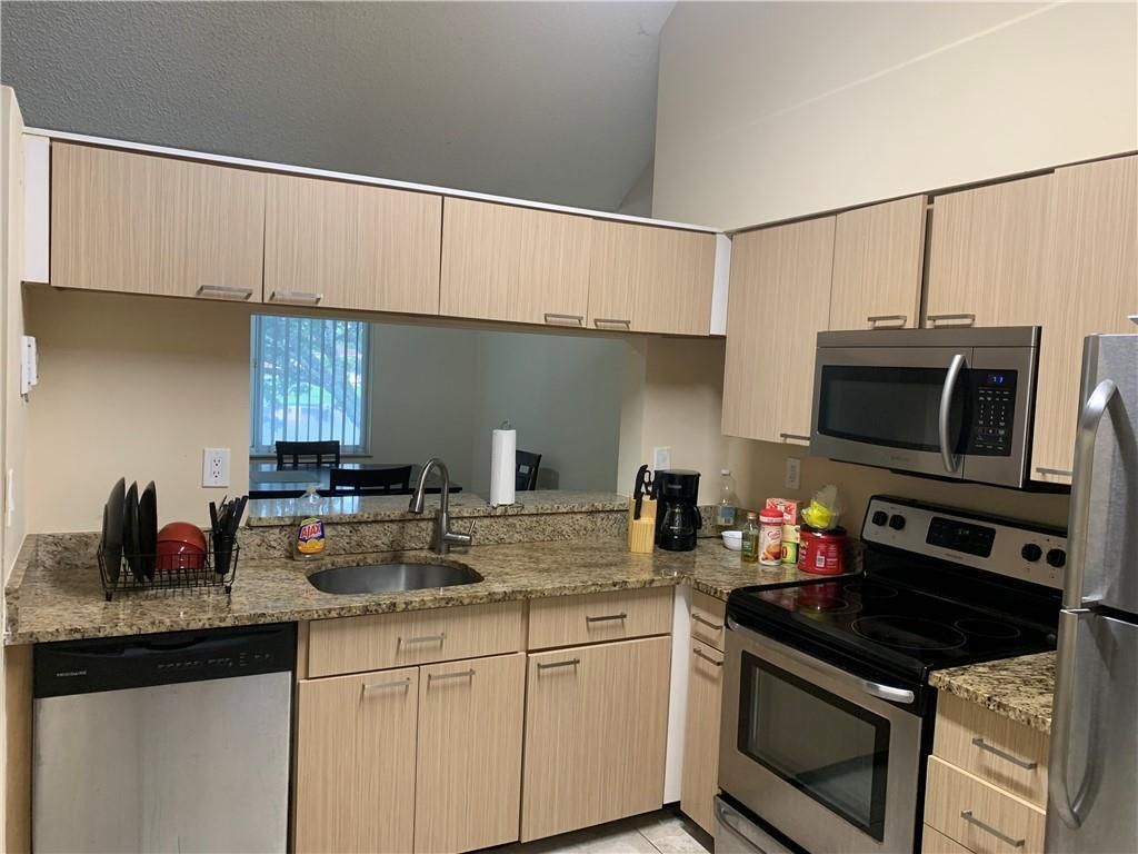 Photo of 858 NW 92nd Avenue #858, Plantation, FL 33324 (MLS # B26012832)