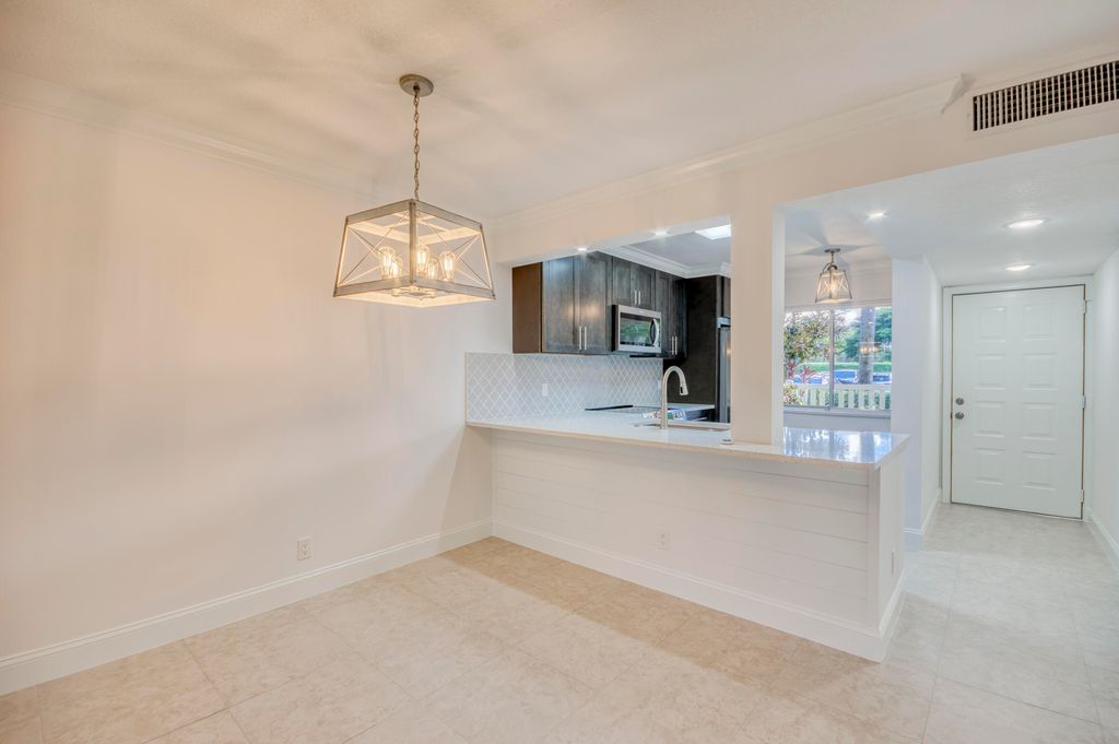 Photo of 6865 Huntington Lane #105, Delray Beach, FL 33446 (MLS # B26034303)