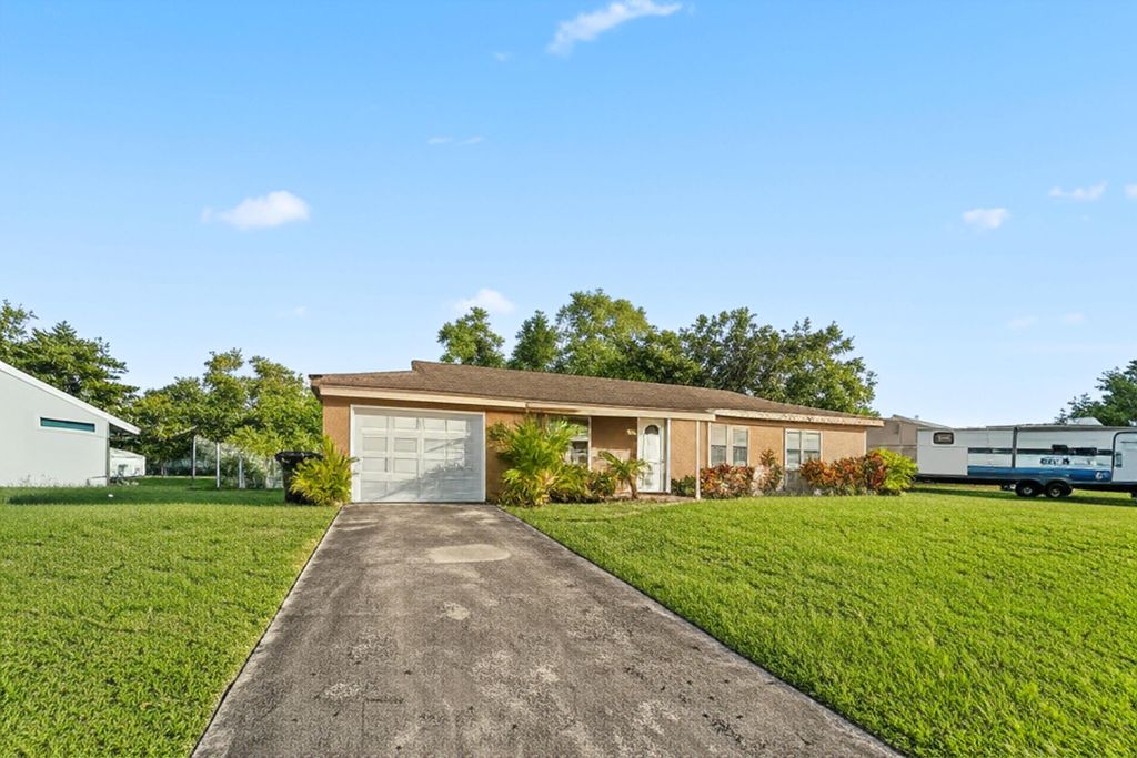 Photo of 226 SW Kimball Circle, Port Saint Lucie, FL 34953 (MLS # R11118739)