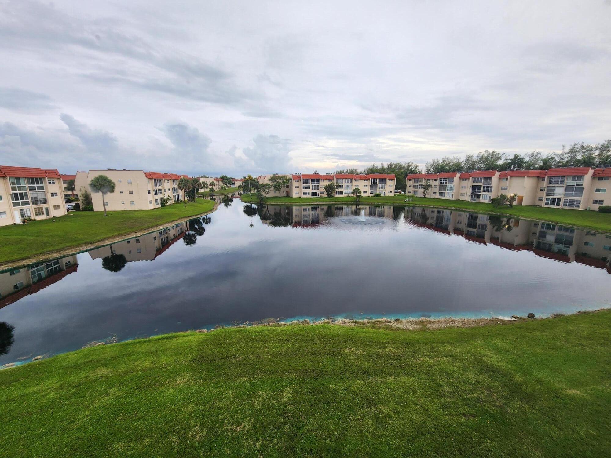 SELLER EXTREMELY MOTIVATED - NICE FURNISHED UNIT WITH LAMINATE WOOD FLOORS AND A BEAUTIFUL AND SERENE VIEW OF THE LAKE AND WATER FOUNTAIN FROM THE BALCONY. FURNISHED AND TURN KEY.SOLD AS-IS