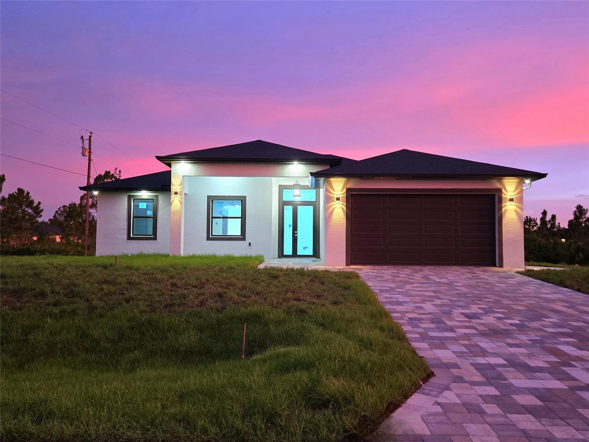 BRAND NEW CONSTRUCTION! This is the home you have been looking for. Featuring an ample floor plan with 4 bedrooms and 3 FULL baths. The kitchen offers European-style modern matte-anti fingerprints cabinets, quartz countertops, stainless steel appliances, and a large waterfall island with snack bar seating. Bathrooms are beautifully finished, and all closets have custom shelving. Enjoy high 10-foot ceilings, tall doors, and impact windows and doors for peace of mind. Porcelain tile floors and energy-saving LED lighting throughout. Covered and tiled Lanai area and welcoming front entrance with anti-slip porcelain, and pavers in driveway. Epoxy finish 2-car garage and separate laundry room with full-size washer and dryer. Move-in ready and perfect for those looking for comfort and quality!
