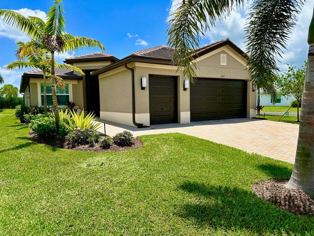 Photo of 11733 SW Coral Cove Parkway, Port Saint Lucie, FL 34987 (MLS # R11001452)