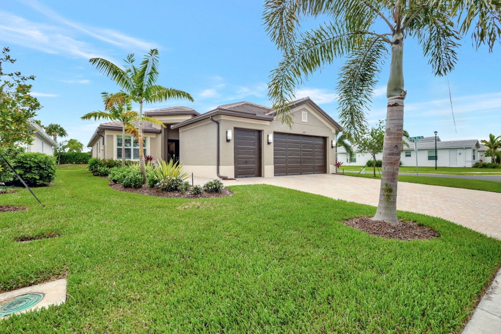 Photo of 11733 SW Coral Cove Parkway, Port Saint Lucie, FL 34987 (MLS # R11001452)