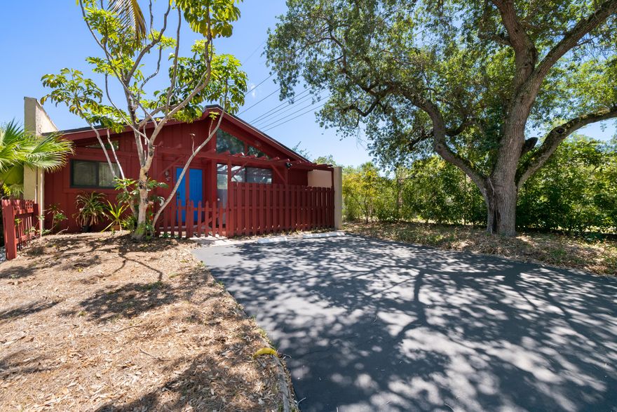 Amazing Opportunity to own a home in this small, friendly community. This 3 bed/2 bath CORNER loft home is super cute w/an updated kitchen & baths, it's own private fenced back yard, screen enclosed patio & a small front patio as well! Park 2 cars right in front of your home. Beautiful natural wood vaulted ceilings that add warmth and character, plus cozy lofts in the bedrooms ideal for extra storage. The primary suite is spacious and includes a walk-in closet and updated bathroom. The grounds & the homes are all kept up nicely per the HOA Docs.  Optimal location between Turnpike & I-95, it's a easy commute anywhere. Amenities include community pool in tropical setting, with solar heating for year-round use, tennis courts, dog park & more. Only $100/monthly HOA!