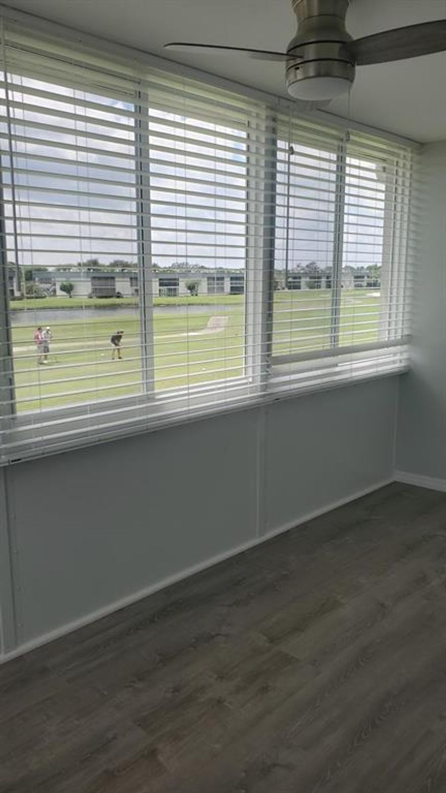 Two bedroom, two full bath, 2nd floor end unit overlooking the golf and lake.  Condo has been updated with waterproof vinyl plank flooring, new baseboards, crown molding, new fans, light fixtures, and stainless appliances.  Brand new permitted impact windows including the enclosed patio, and a new front door.  Community amenities include: Multimillion dollar clubhouses, indoor pool, theatre, 2 golf courses, 2 restaurants, courtesy buses & much more.  55+ gated community.