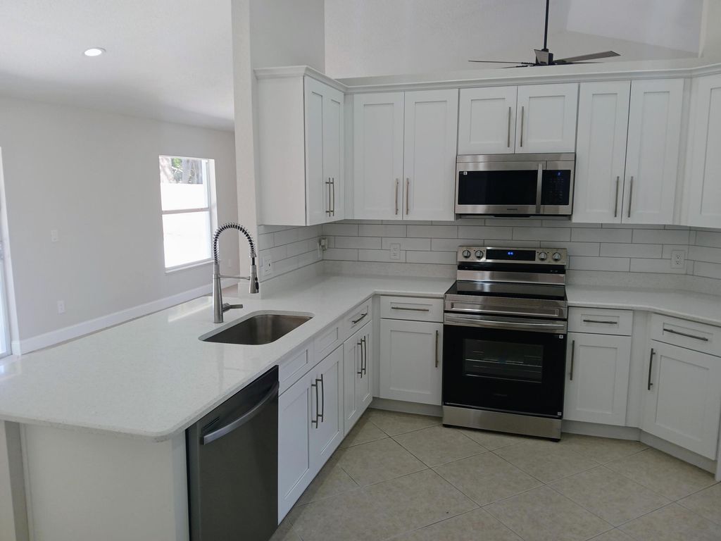 Photo of 3450 SW Martin Street, Port Saint Lucie, FL 34953 (MLS # R11150187)