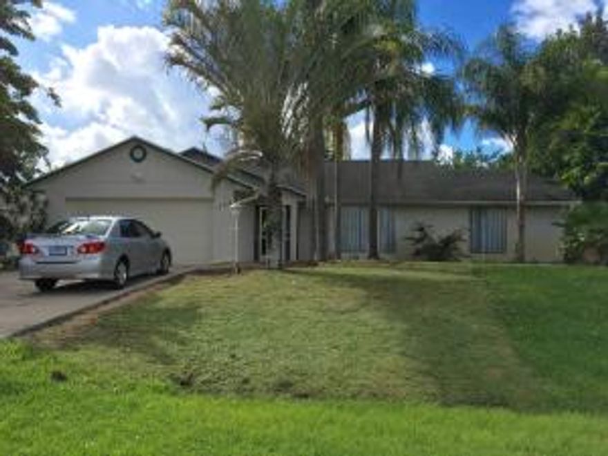 Three bedroom two bathroom, pet friendly home featuring open bright updated kitchen with huge windows overlooking screened lanai and fully fenced yard. Brand new A/C.