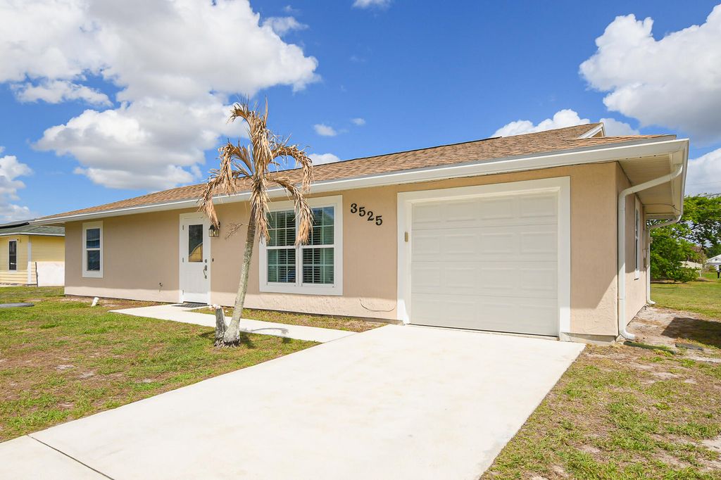 Photo of 3525 SW Rivera Street, Port Saint Lucie, FL 34953 (MLS # B26003564)