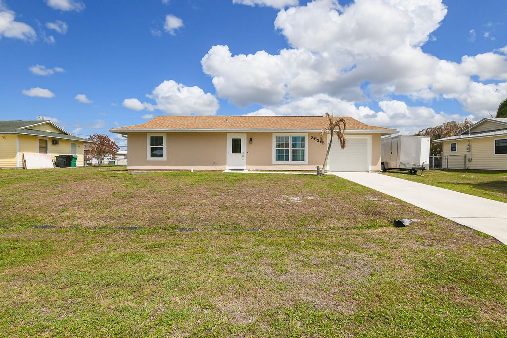 Photo of 3525 SW Rivera Street, Port Saint Lucie, FL 34953 (MLS # B26003564)